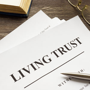 Living Trust document on a desk with a pen