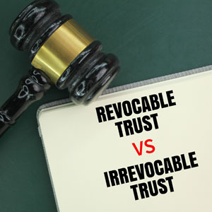 Gavel next to a notebook with the text 'Revocable Trust vs Irrevocable Trust