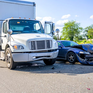 Collision scene depicting a truck accident with a car